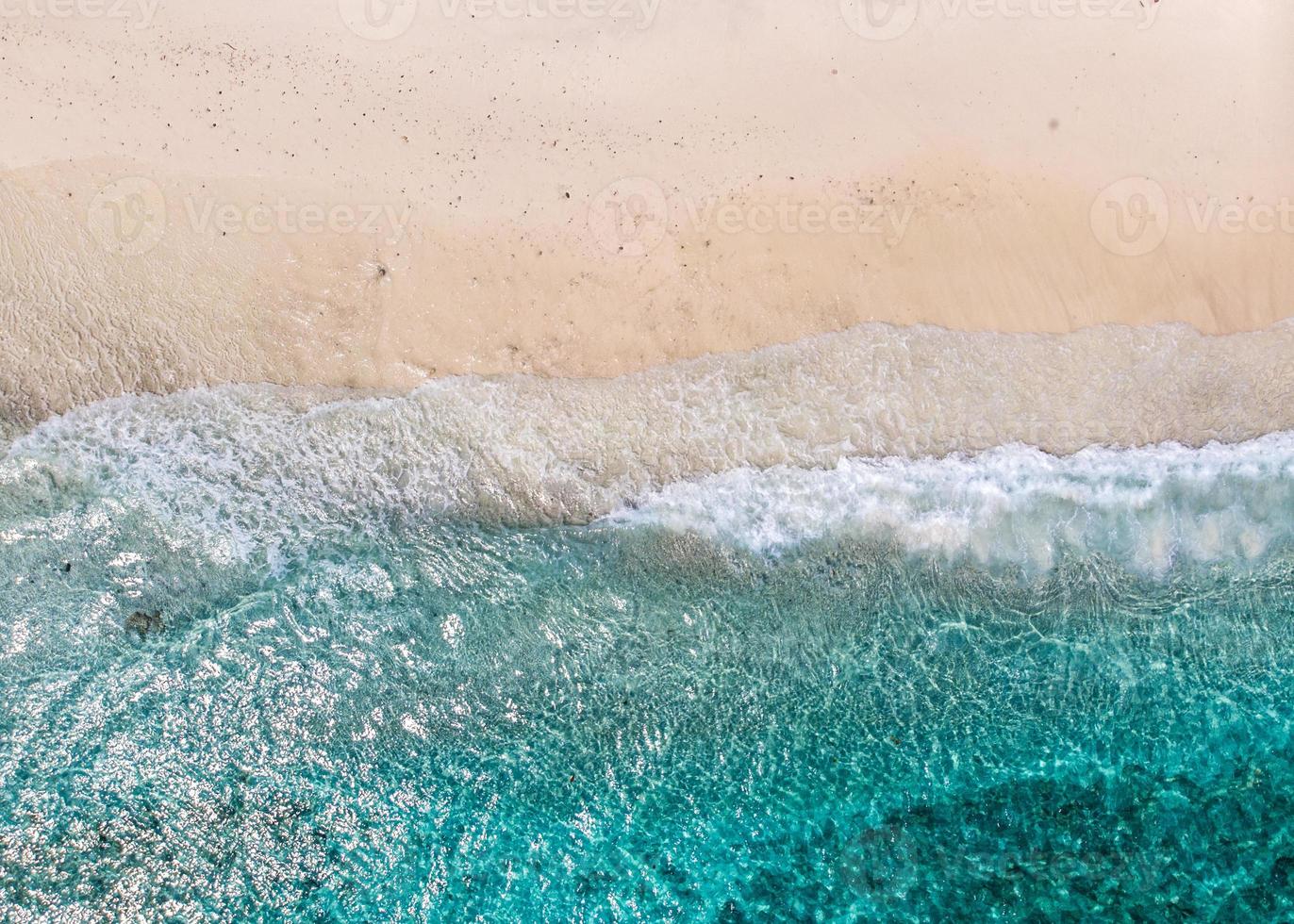 Aerial view of clear sea waves and white sandy beaches in summer. photo