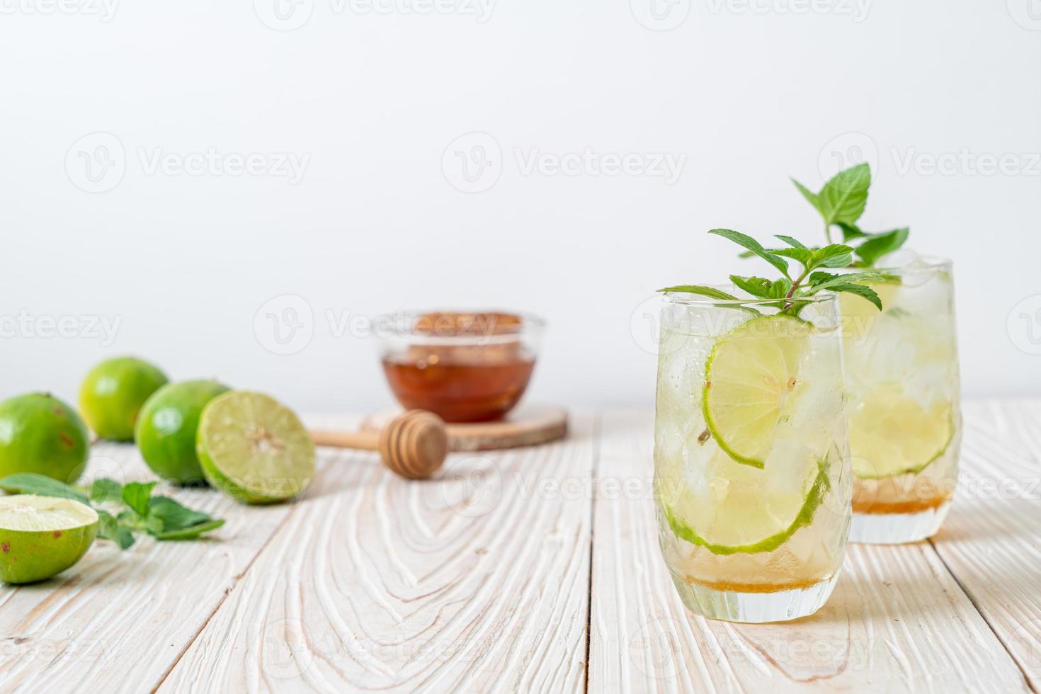 Iced honey and lime soda with mint - refreshing drink photo