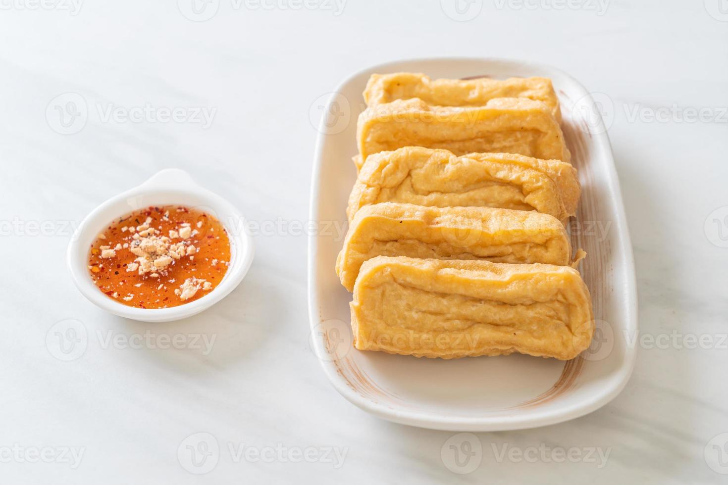 Fried tofu with sauce - vegan and vegetarian food style photo