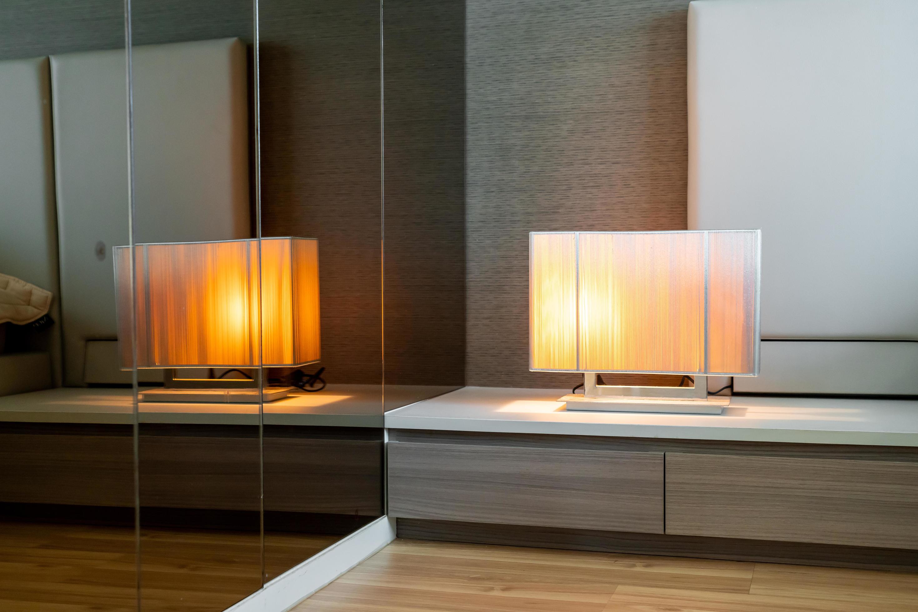 Beautiful lamp beside bed decoration in bedroom 2992775 Stock Photo at Vecteezy