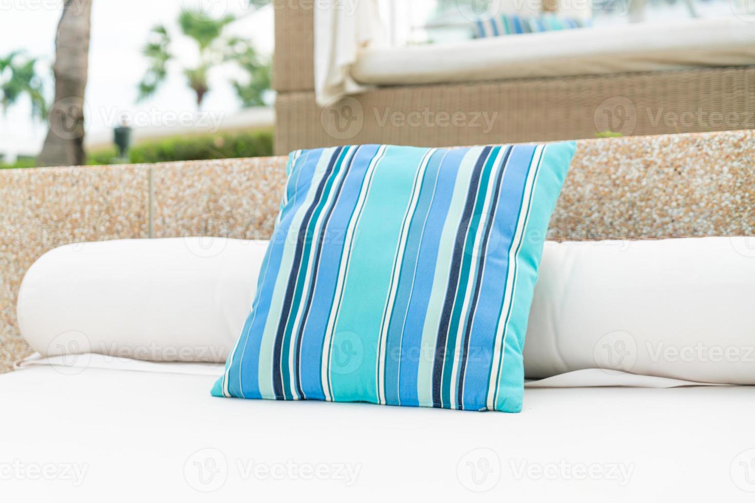 Comfortable pillow on pavilion near beach - travel and vacation concept photo