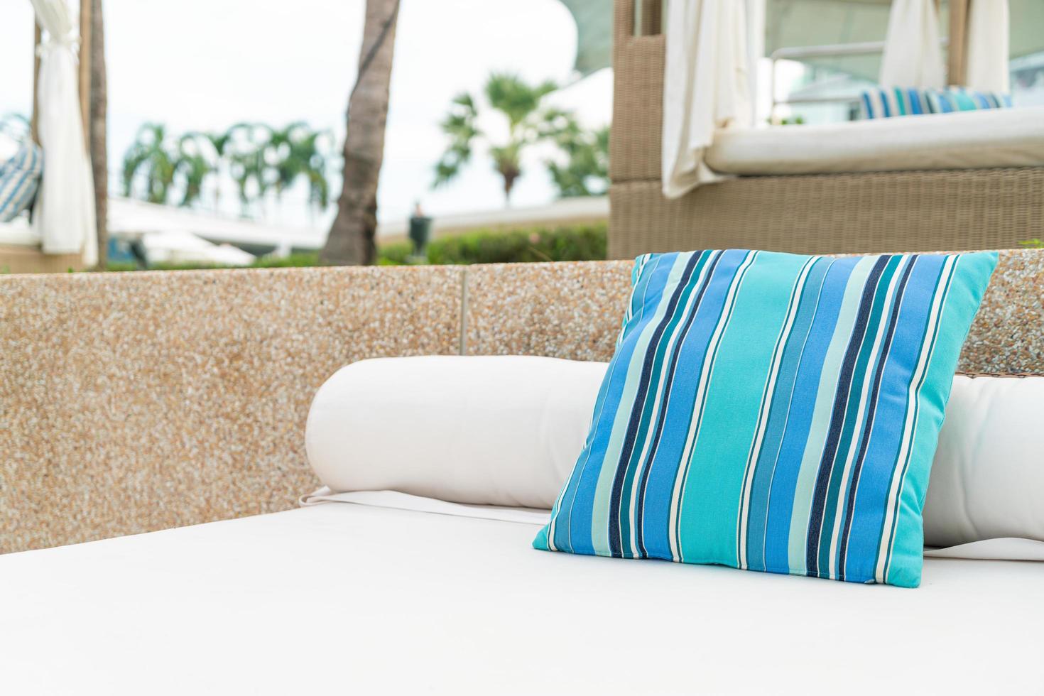 Comfortable pillow on pavilion near beach - travel and vacation concept photo