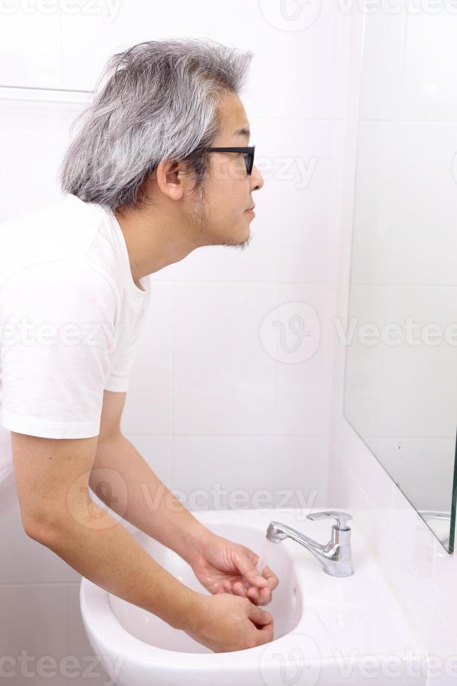 Hand Washing in Washbasin photo