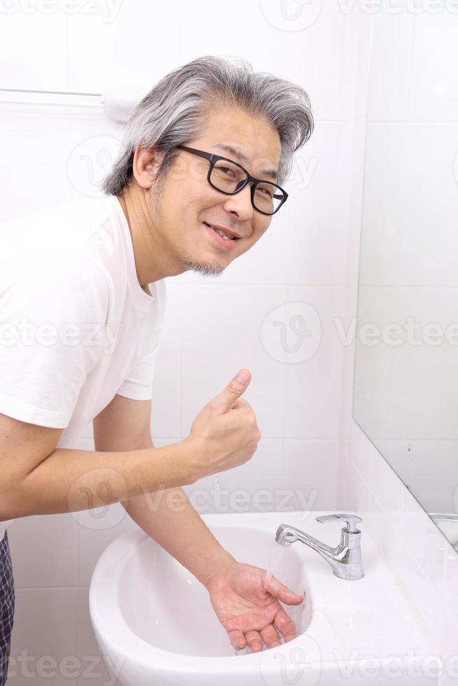 Hand Washing in Washbasin photo