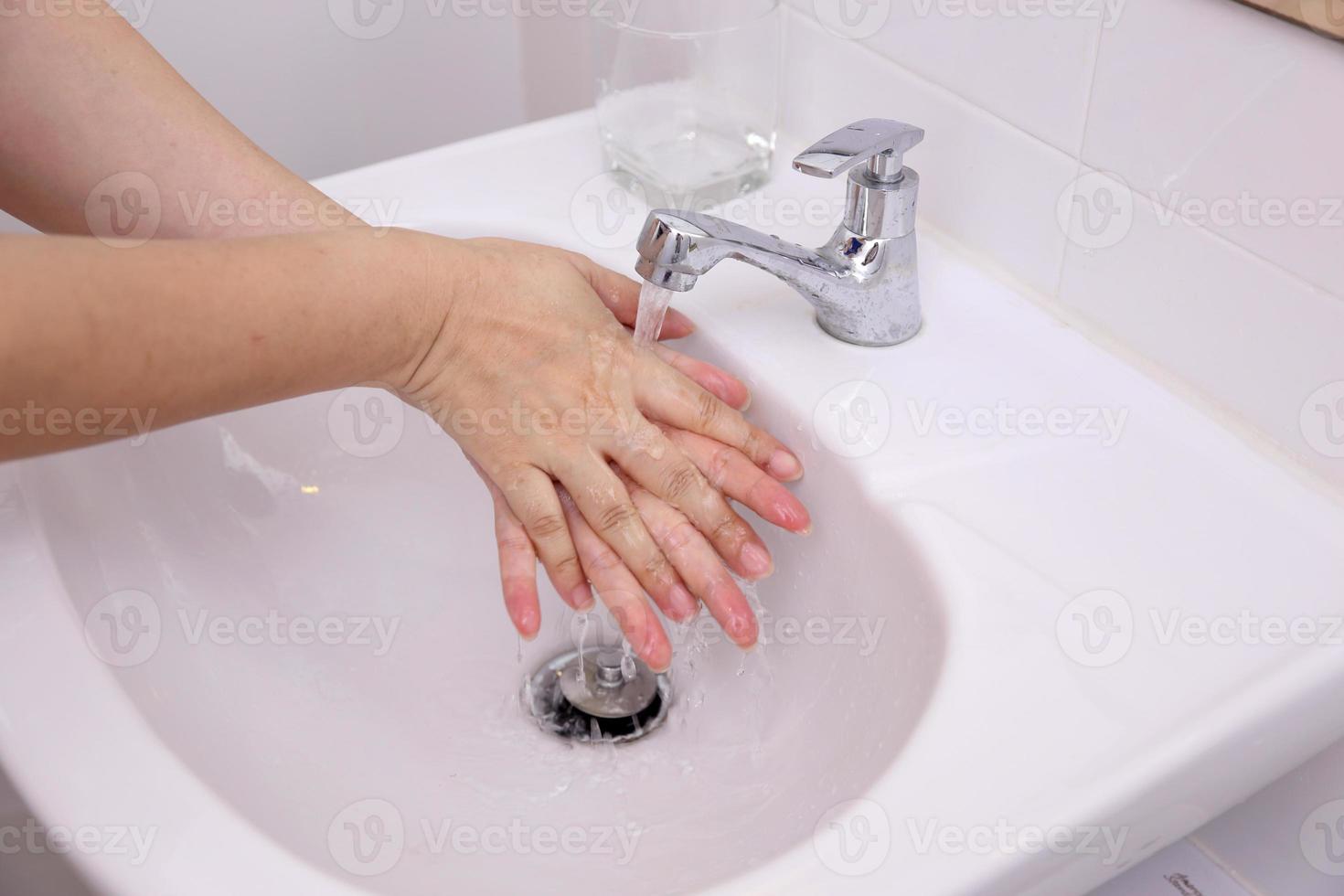 Hand Washing in Washbasin photo