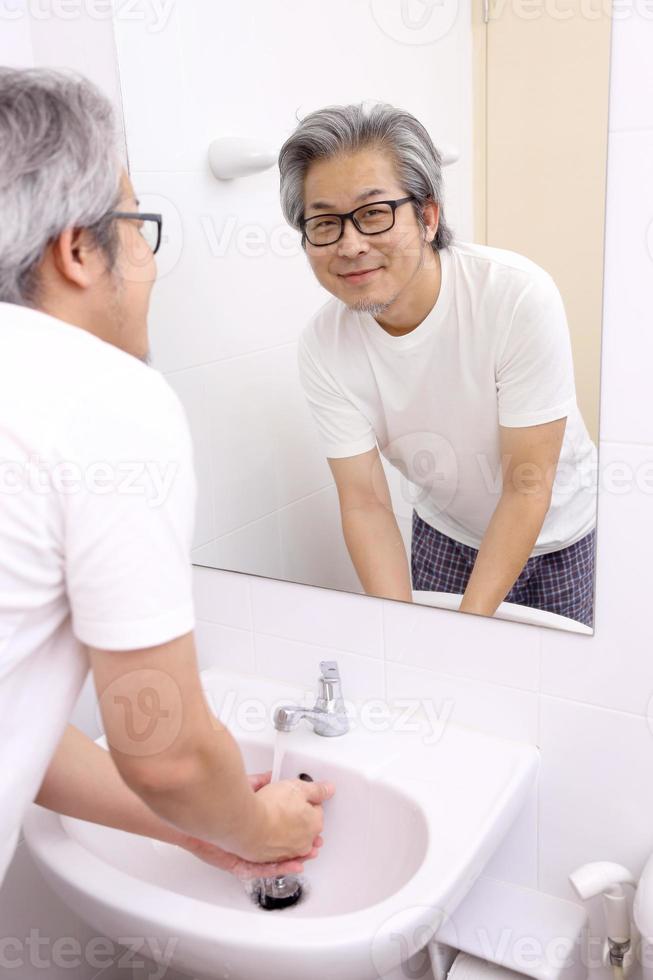 Hand Washing in Washbasin photo