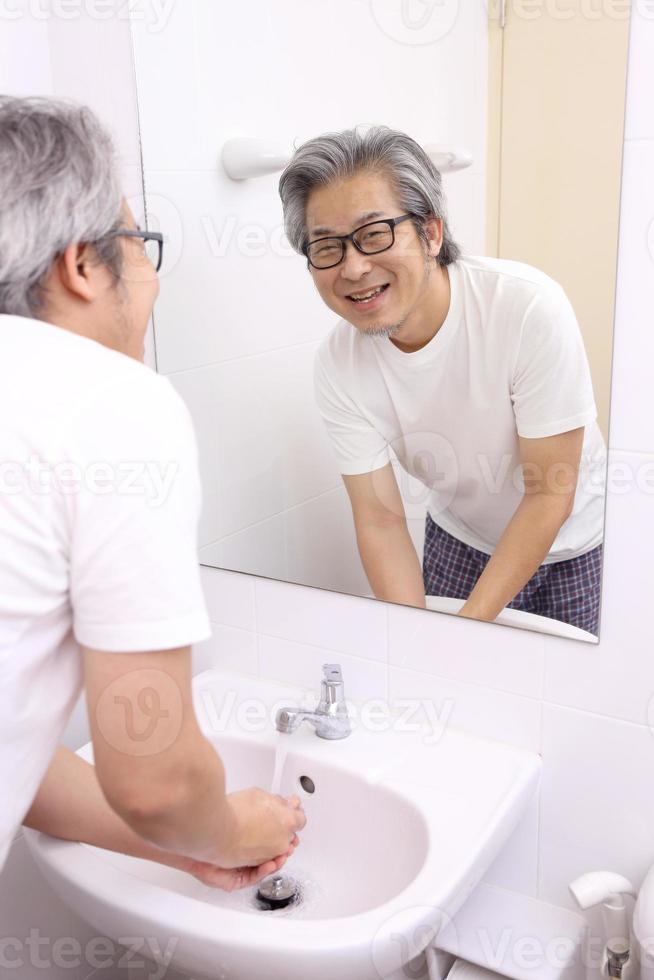 Hand Washing in Washbasin photo