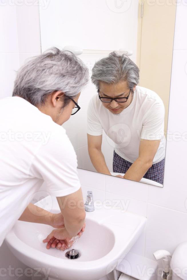 Hand Washing in Washbasin photo