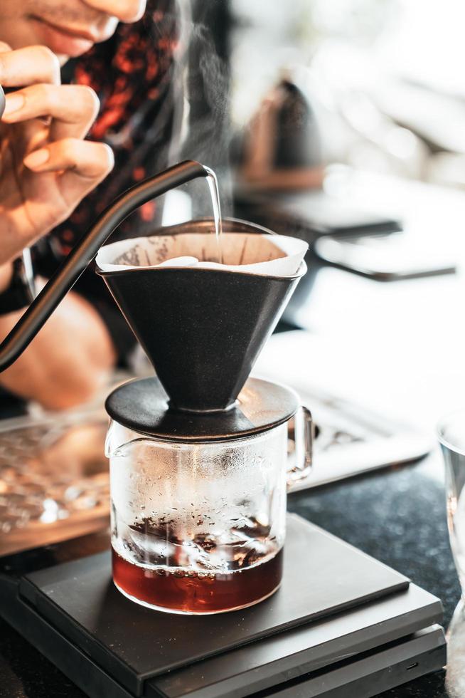 Pouring hot water for dripping Arabica coffee photo