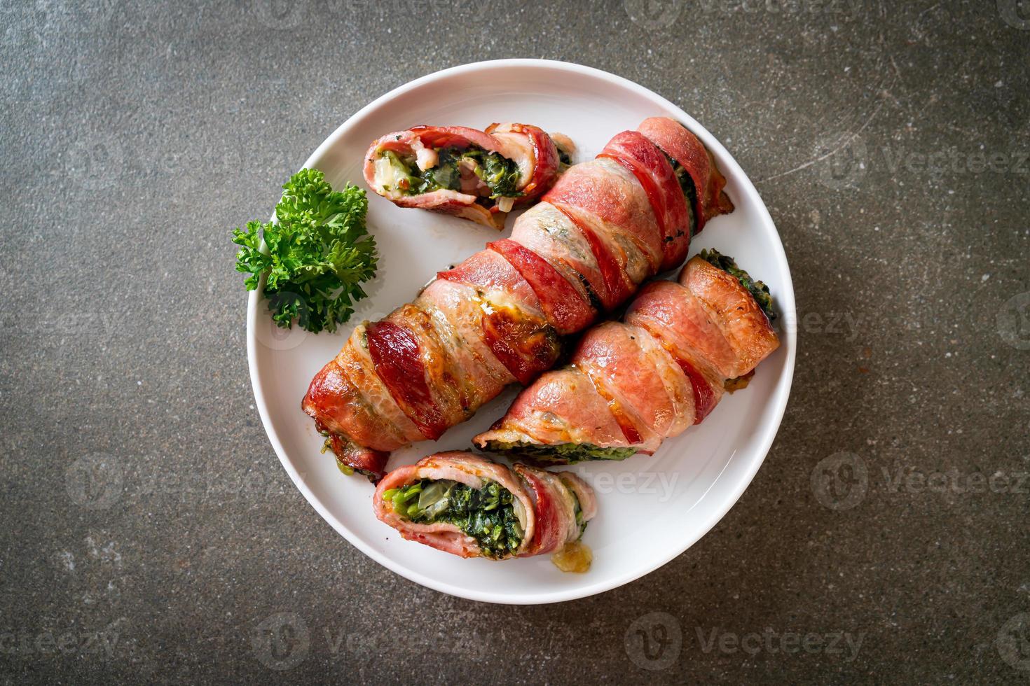 Baked bacon roll stuffed spinach and cheese photo