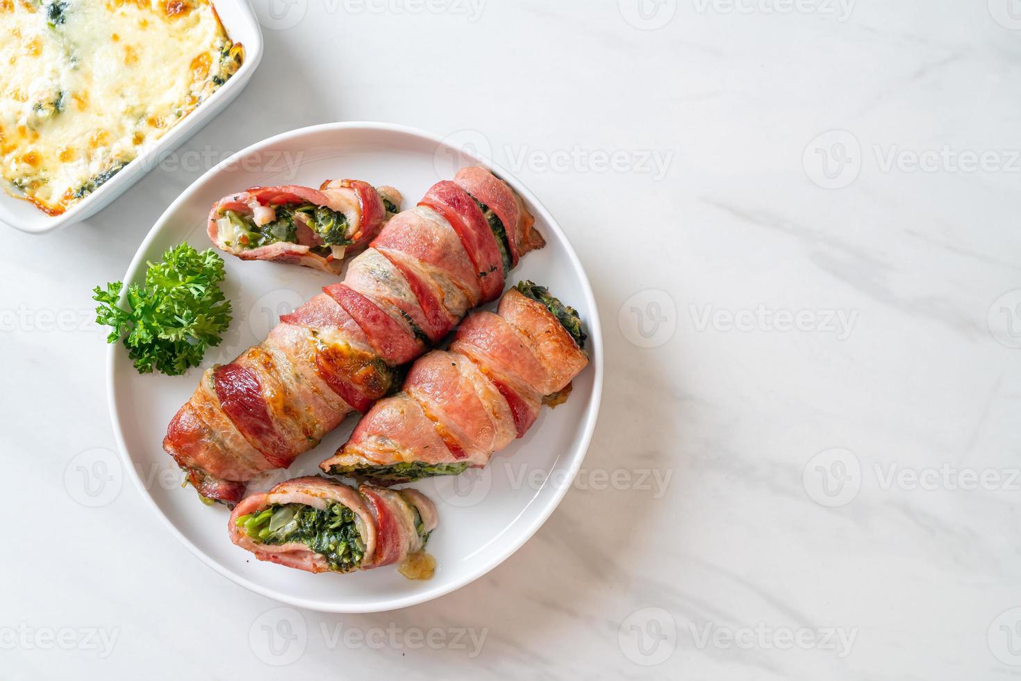 Baked bacon roll stuffed spinach and cheese photo