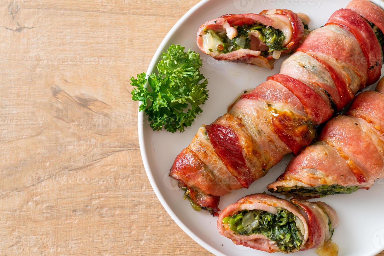 Baked bacon roll stuffed spinach and cheese photo