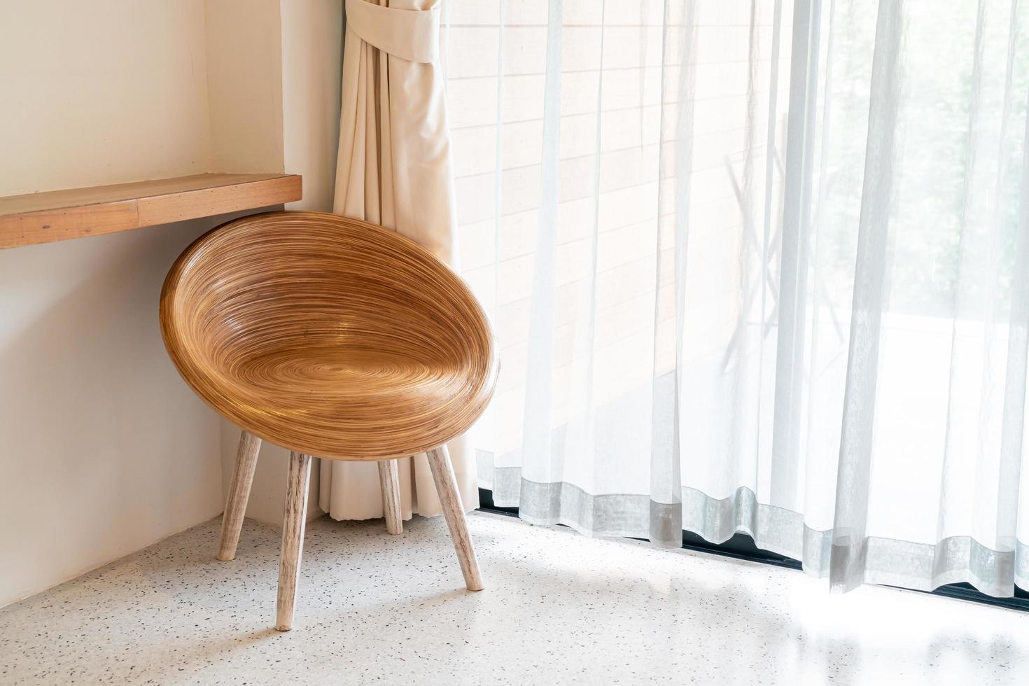 Empty wood chair on corner in a room photo