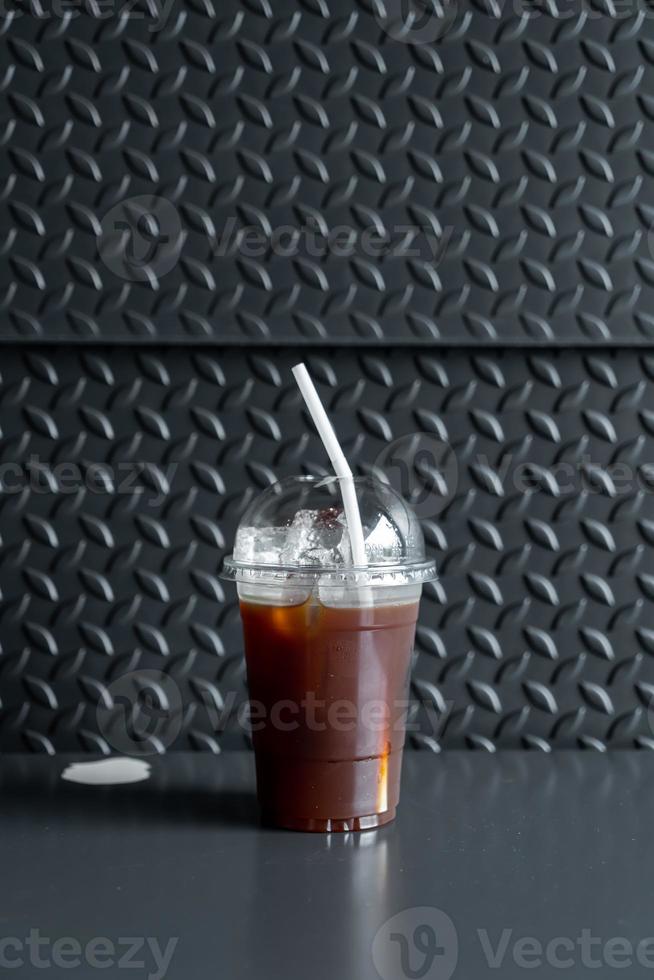 Iced Americano black coffee glass in coffee shop photo