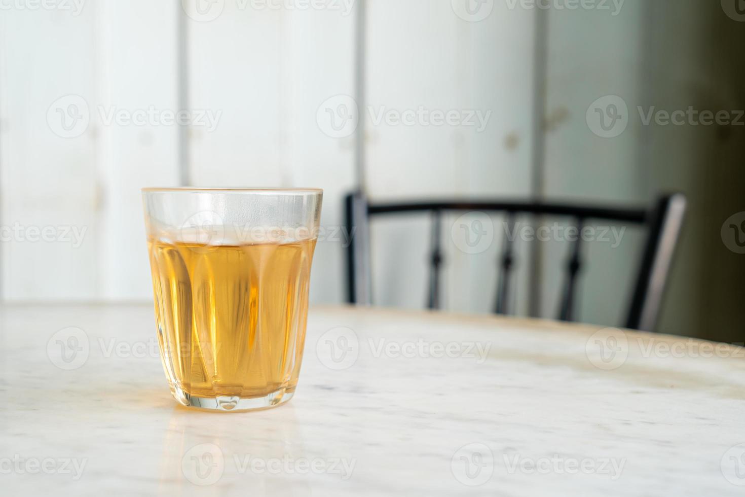 Hot Chinese tea in glass on table photo