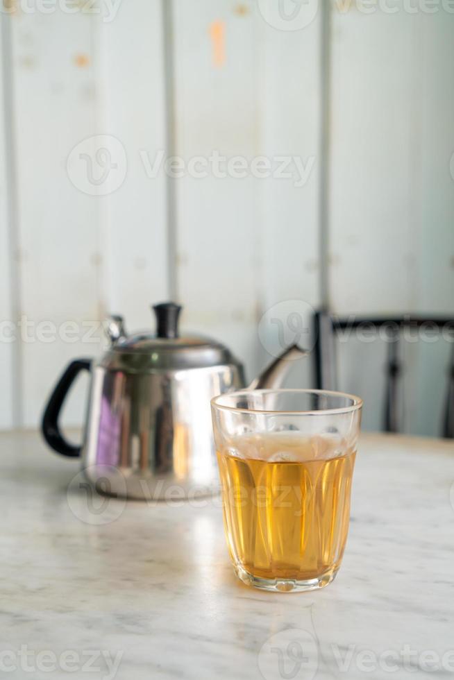 Hot Chinese tea in glass on table photo