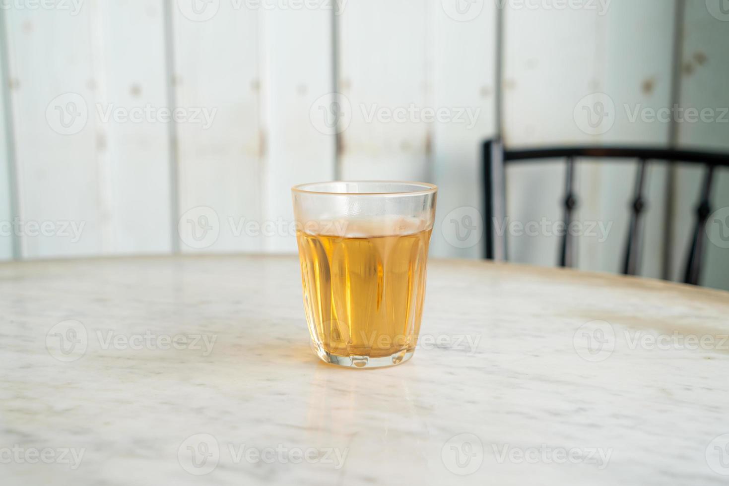 Hot Chinese tea in glass on table photo