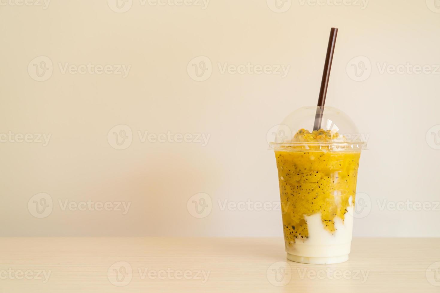 Fresh passion fruit smoothies with yogurt in glass photo