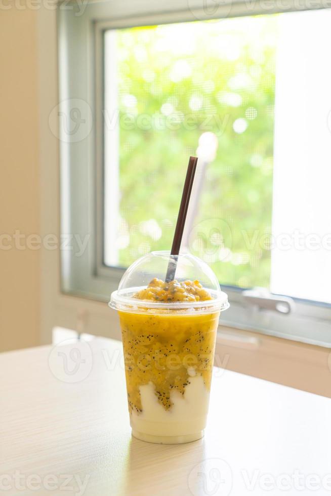 Fresh passion fruit smoothies with yogurt in glass photo