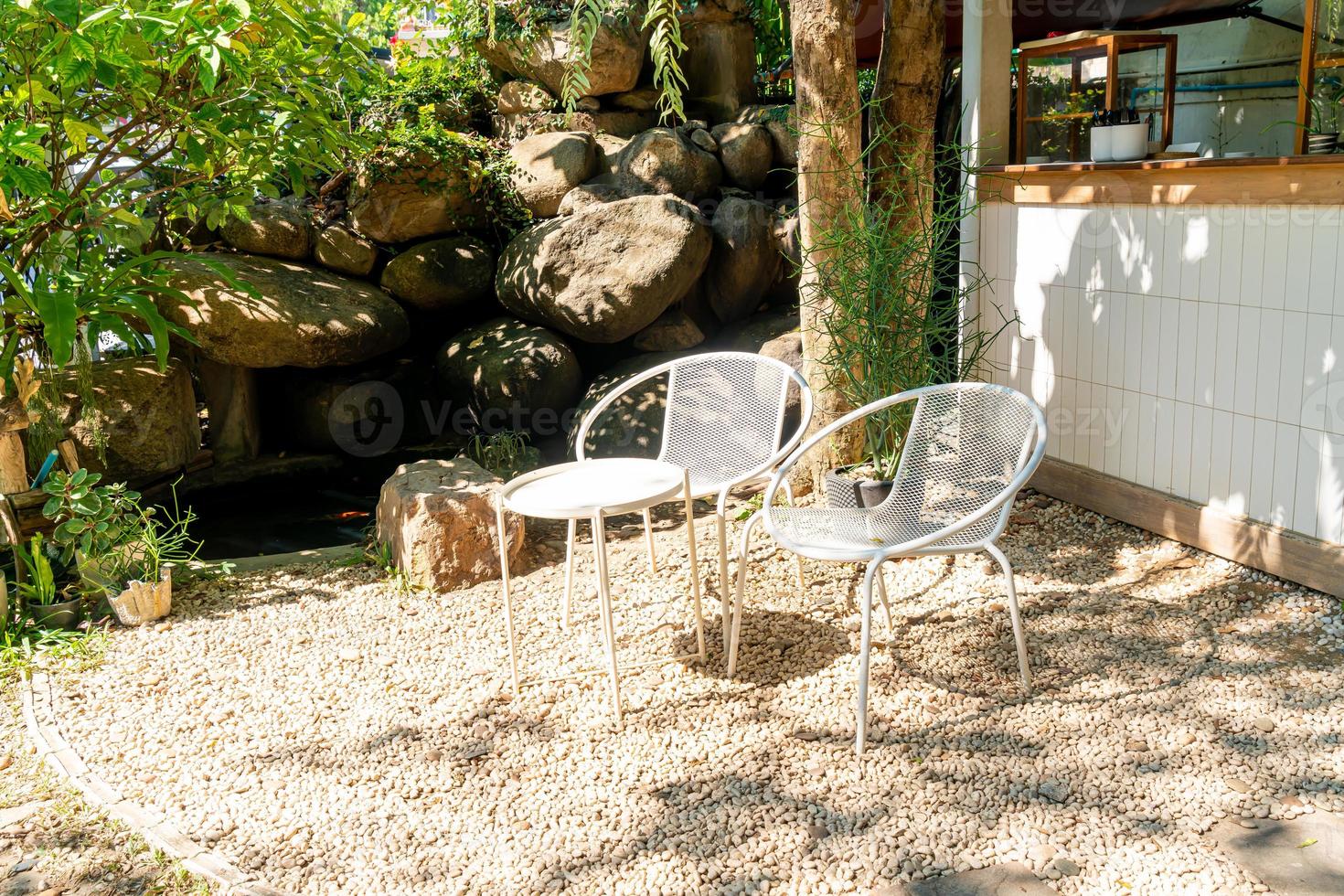 Empty white chair in the garden photo