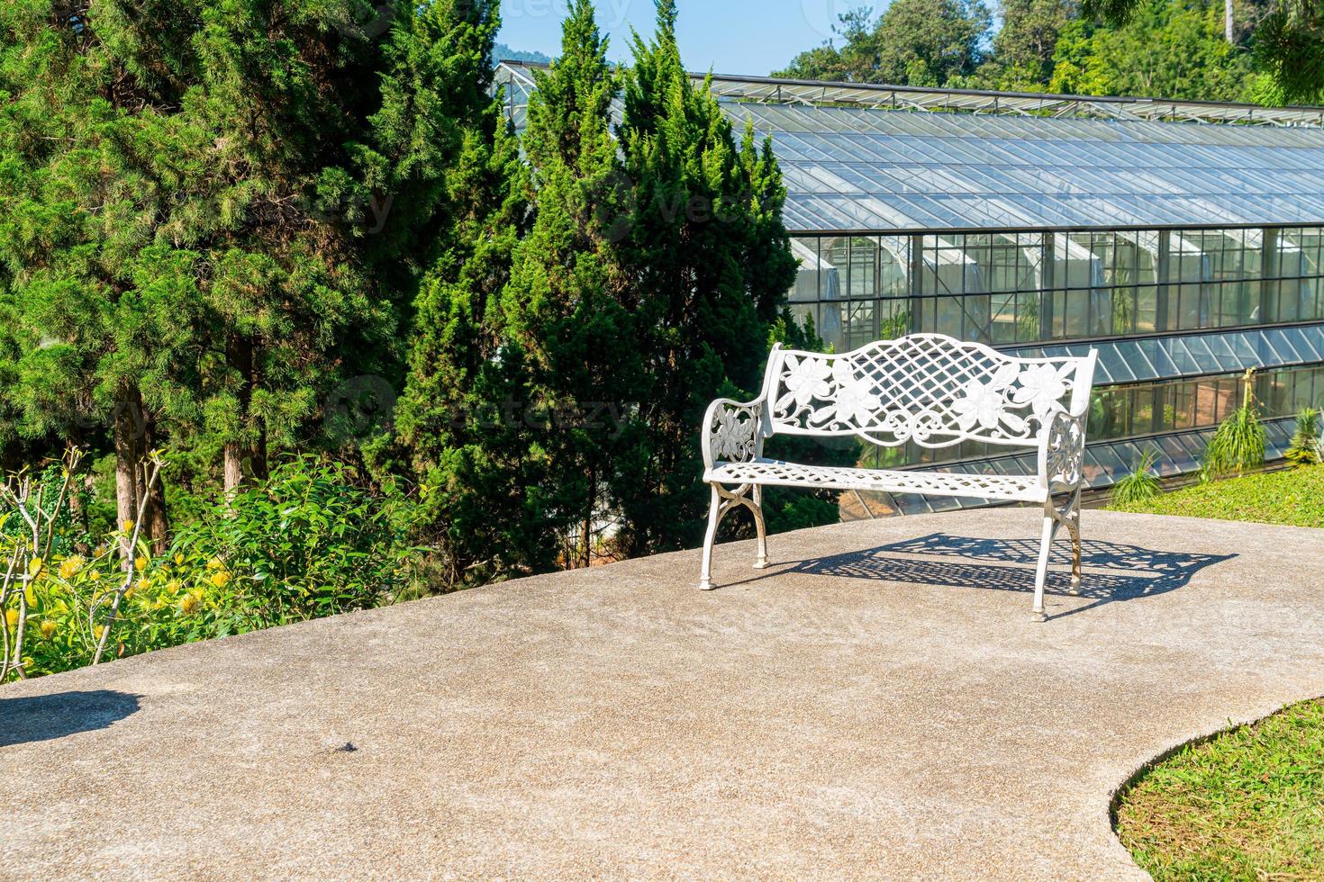 Empty white chair in the garden photo