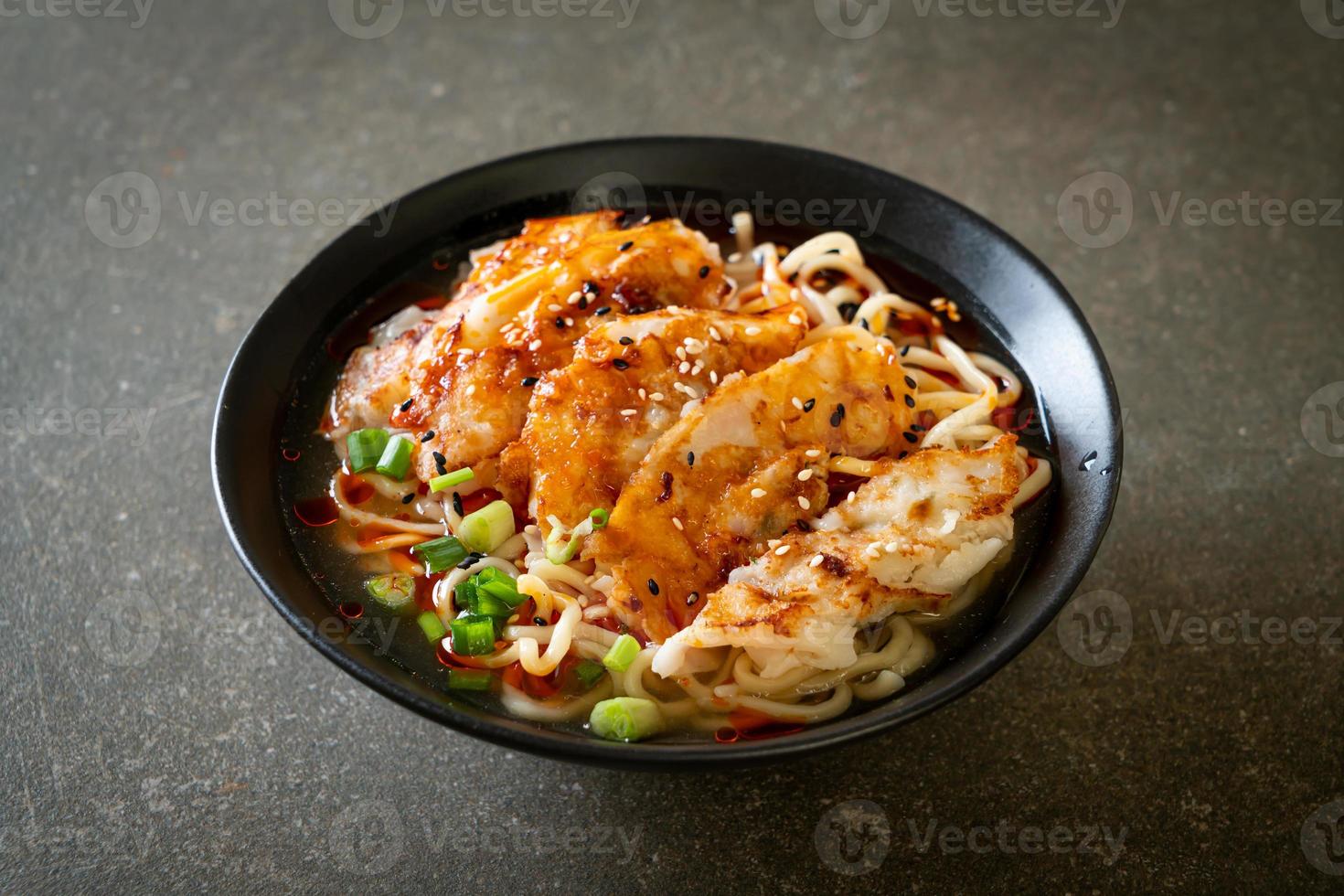 Ramen noodles with gyoza or pork dumplings - Asian food style photo