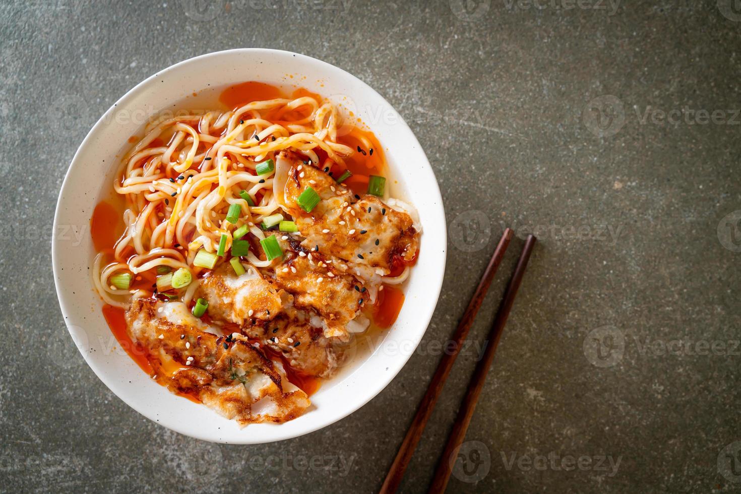 Ramen noodles with gyoza or pork dumplings - Asian food style photo