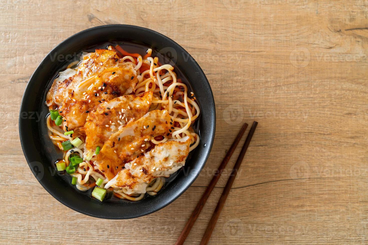 Ramen noodles with gyoza or pork dumplings - Asian food style photo