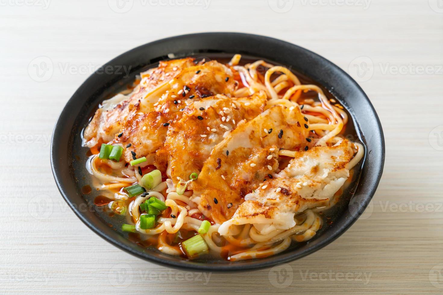 Ramen noodles with gyoza or pork dumplings - Asian food style photo