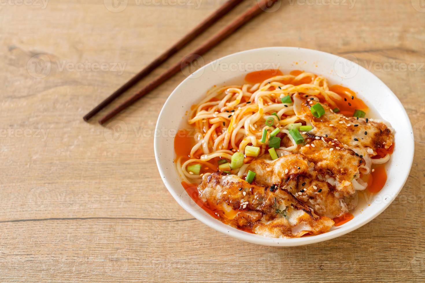 Ramen noodles with gyoza or pork dumplings - Asian food style photo