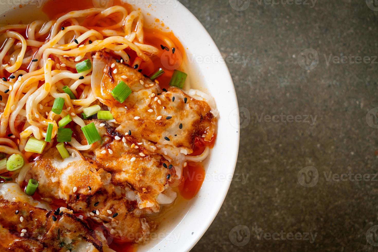 Ramen noodles with gyoza or pork dumplings - Asian food style photo