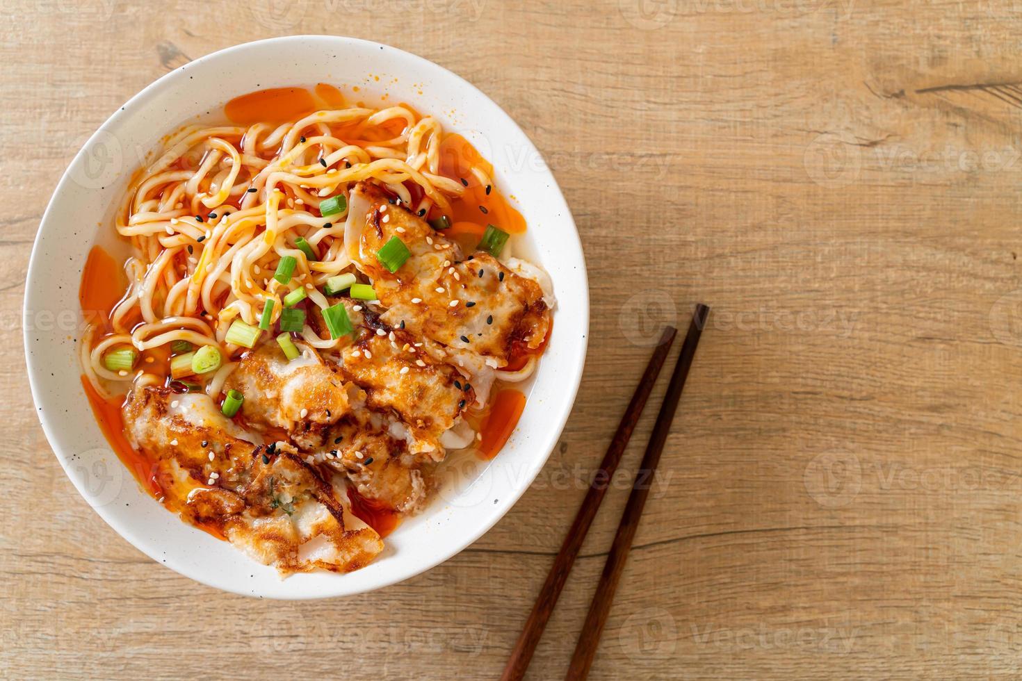 Ramen noodles with gyoza or pork dumplings - Asian food style photo