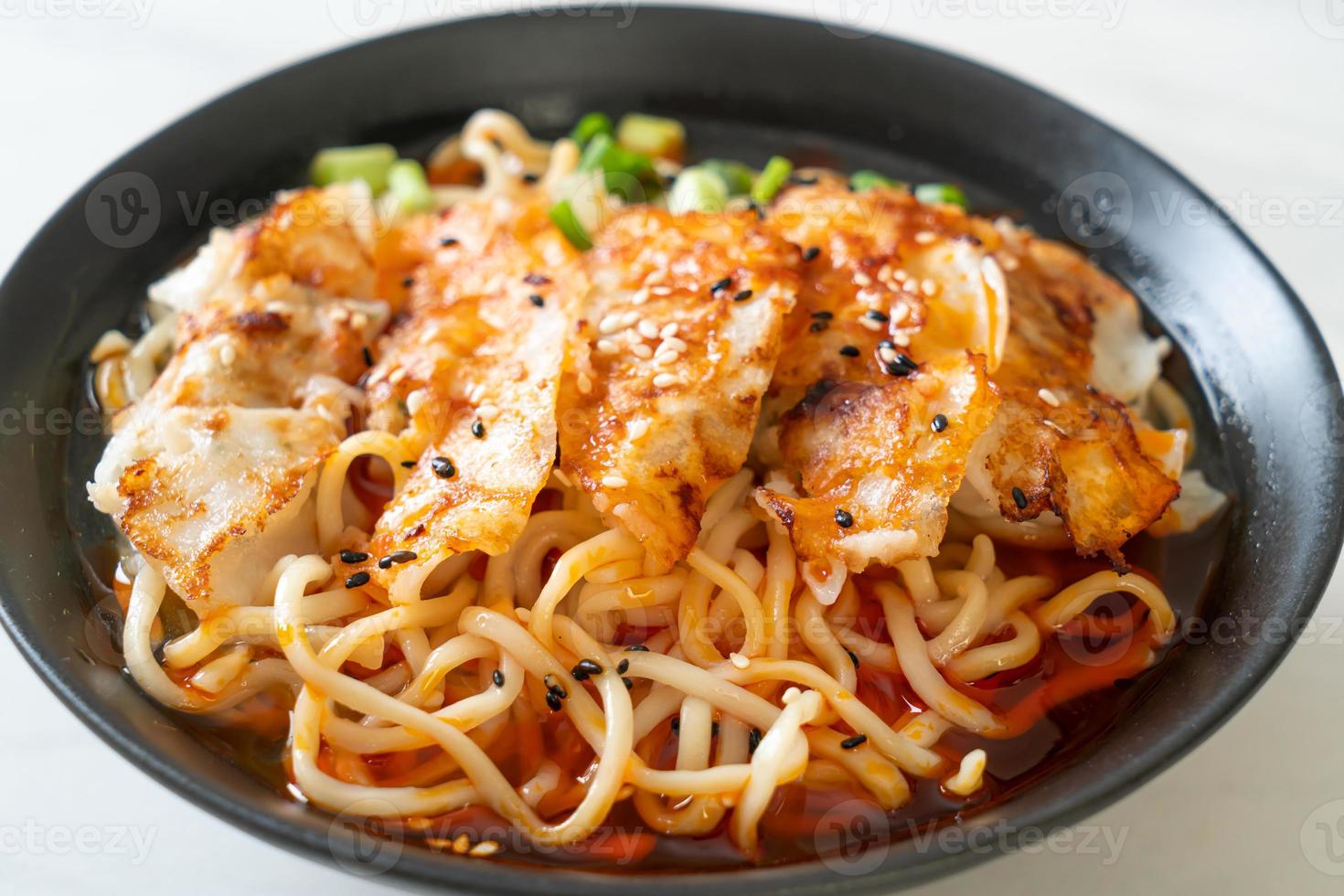 Ramen noodles with gyoza or pork dumplings - Asian food style photo