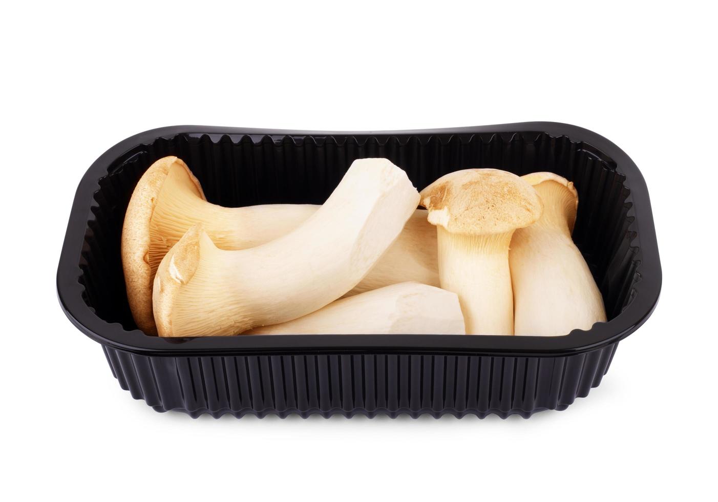 Fresh mushrooms in black container photo