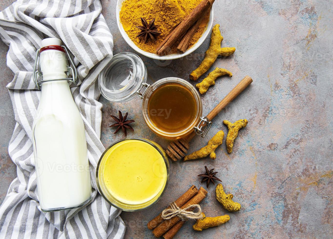 Yellow turmeric latte drink. photo