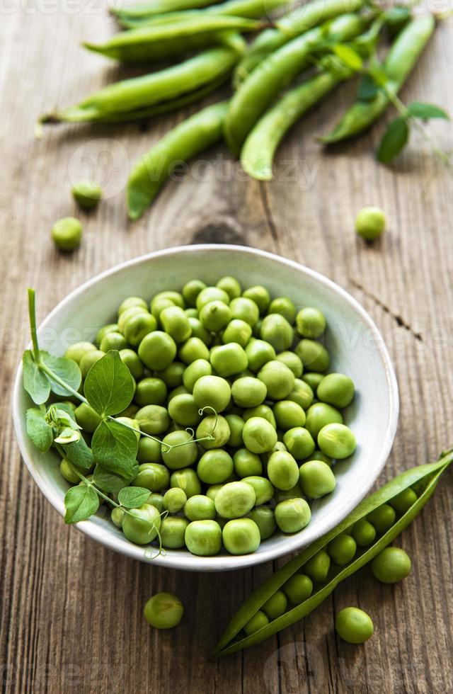 Green peas in white bowl photo