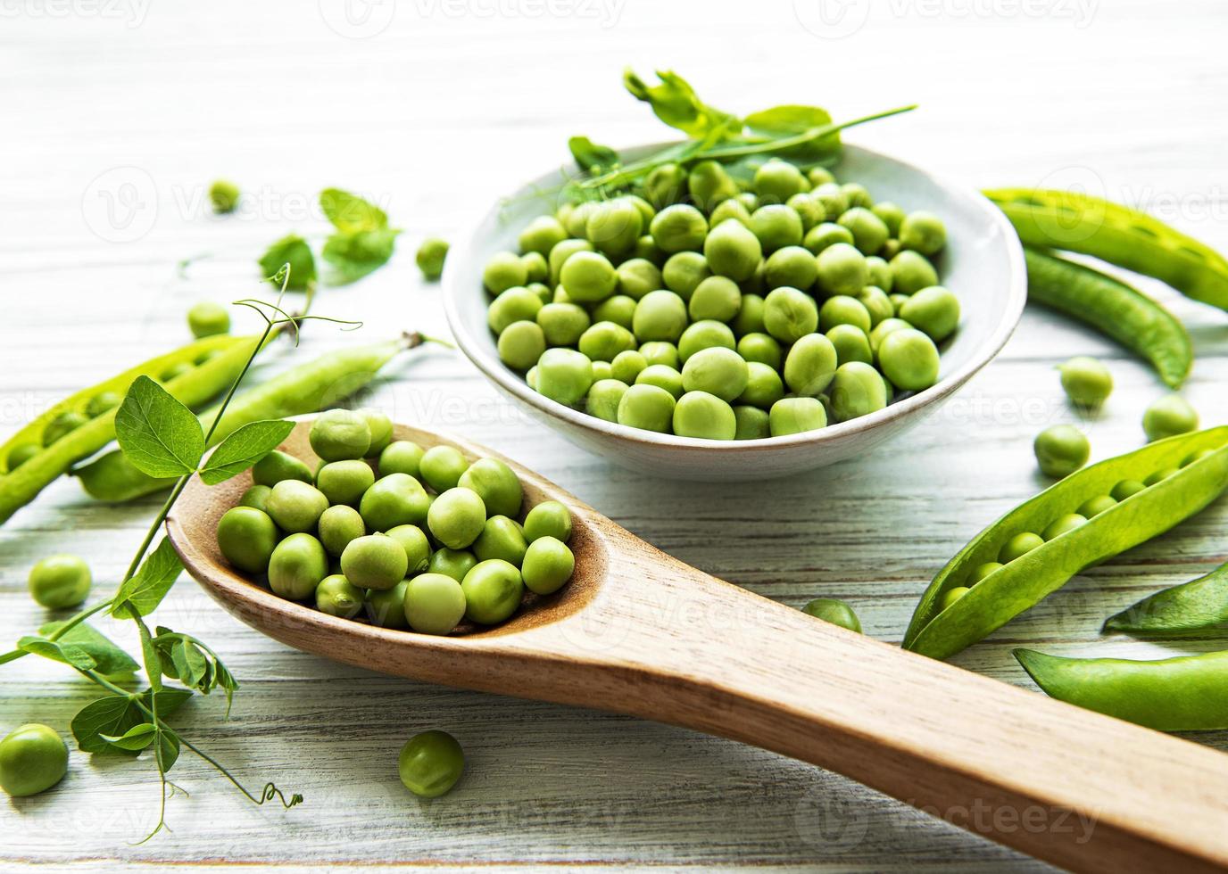 Green peas in white bowl photo