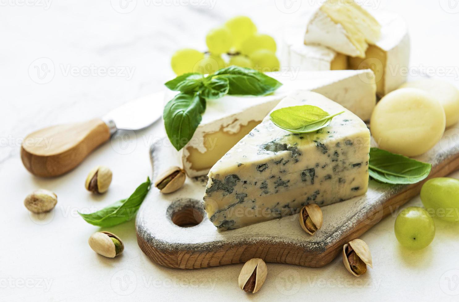 Various types of cheese and snacks photo