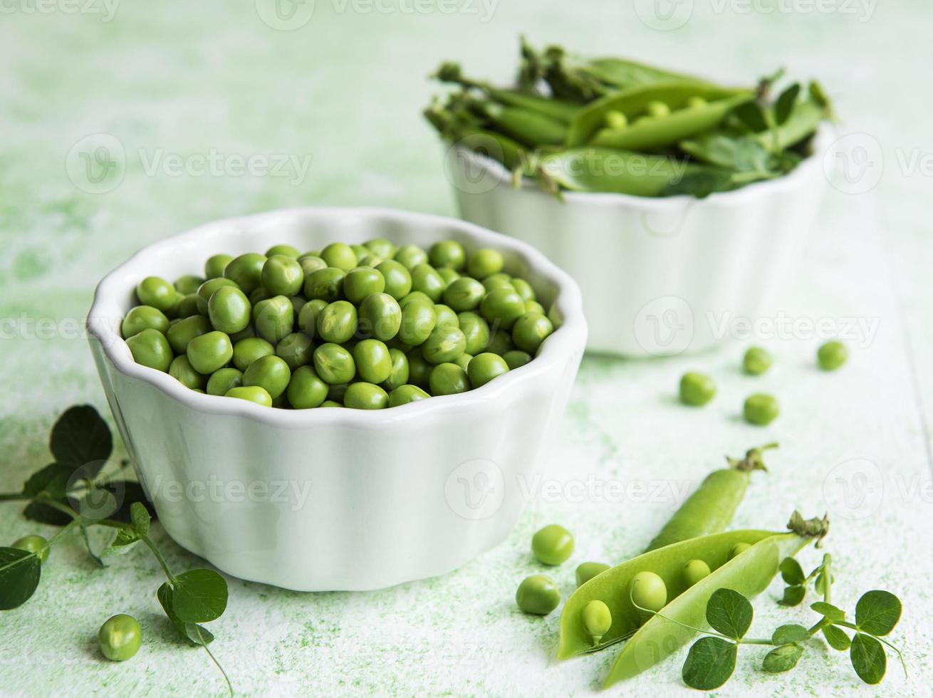 Fresh green peas pods and green peas photo