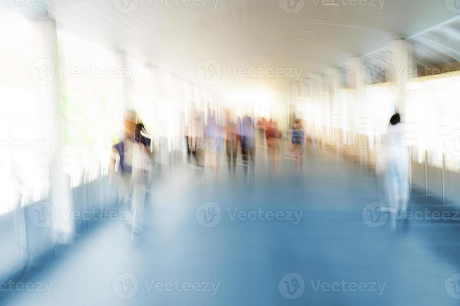 People walking in motion blur in the city photo