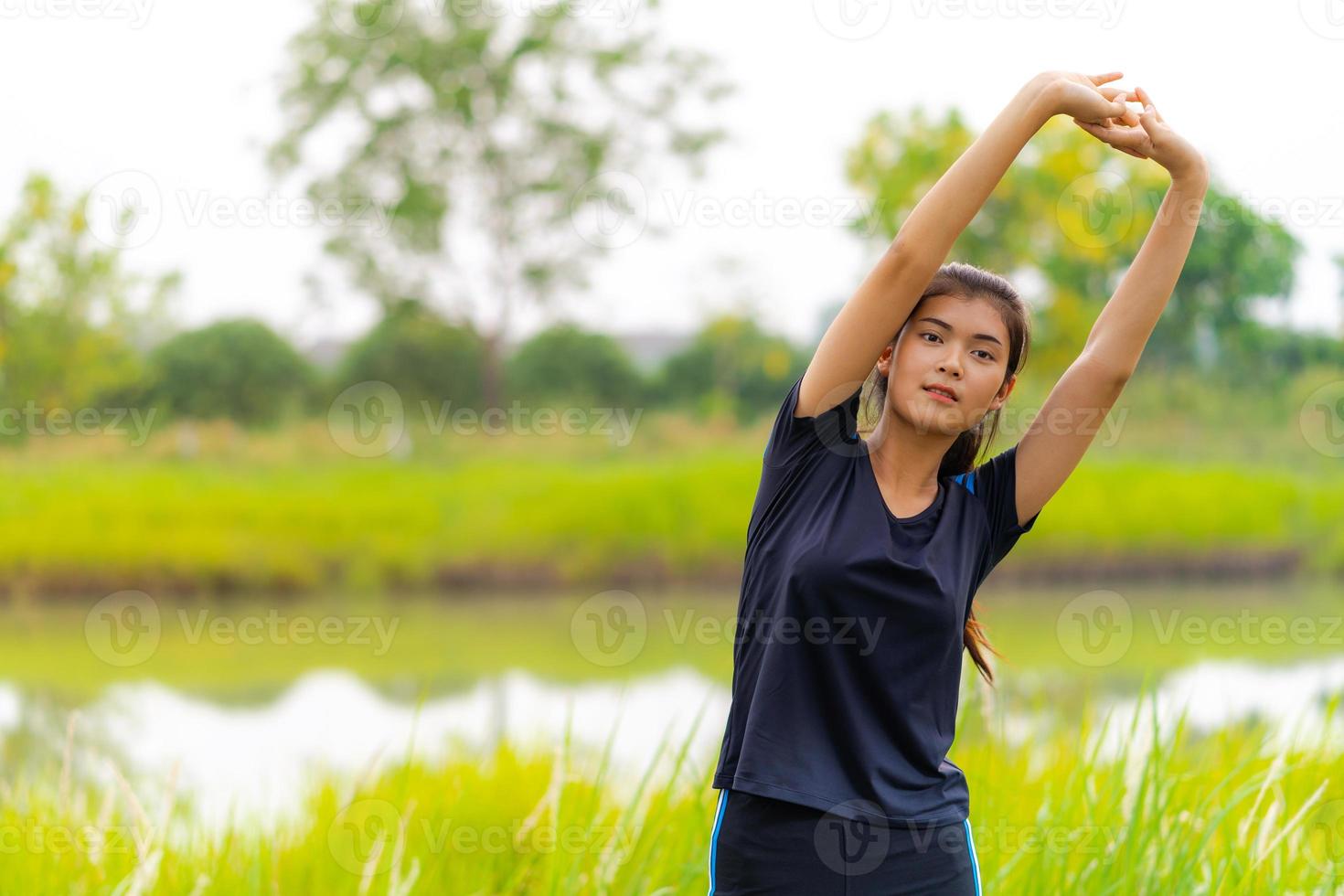 Portrait of beautiful girl in sportswear smiling during exercise photo