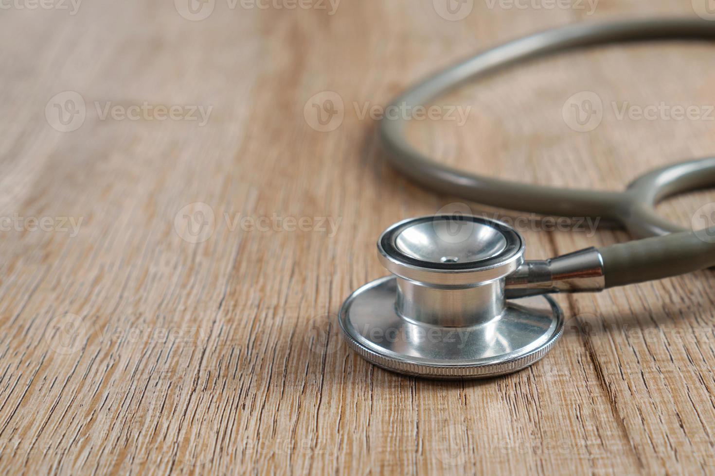 Stethoscope on a wooden background photo