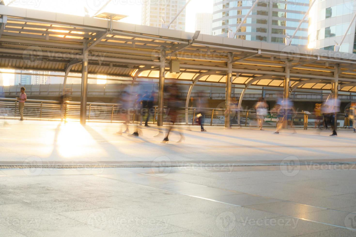 People walking in motion blur in the city photo