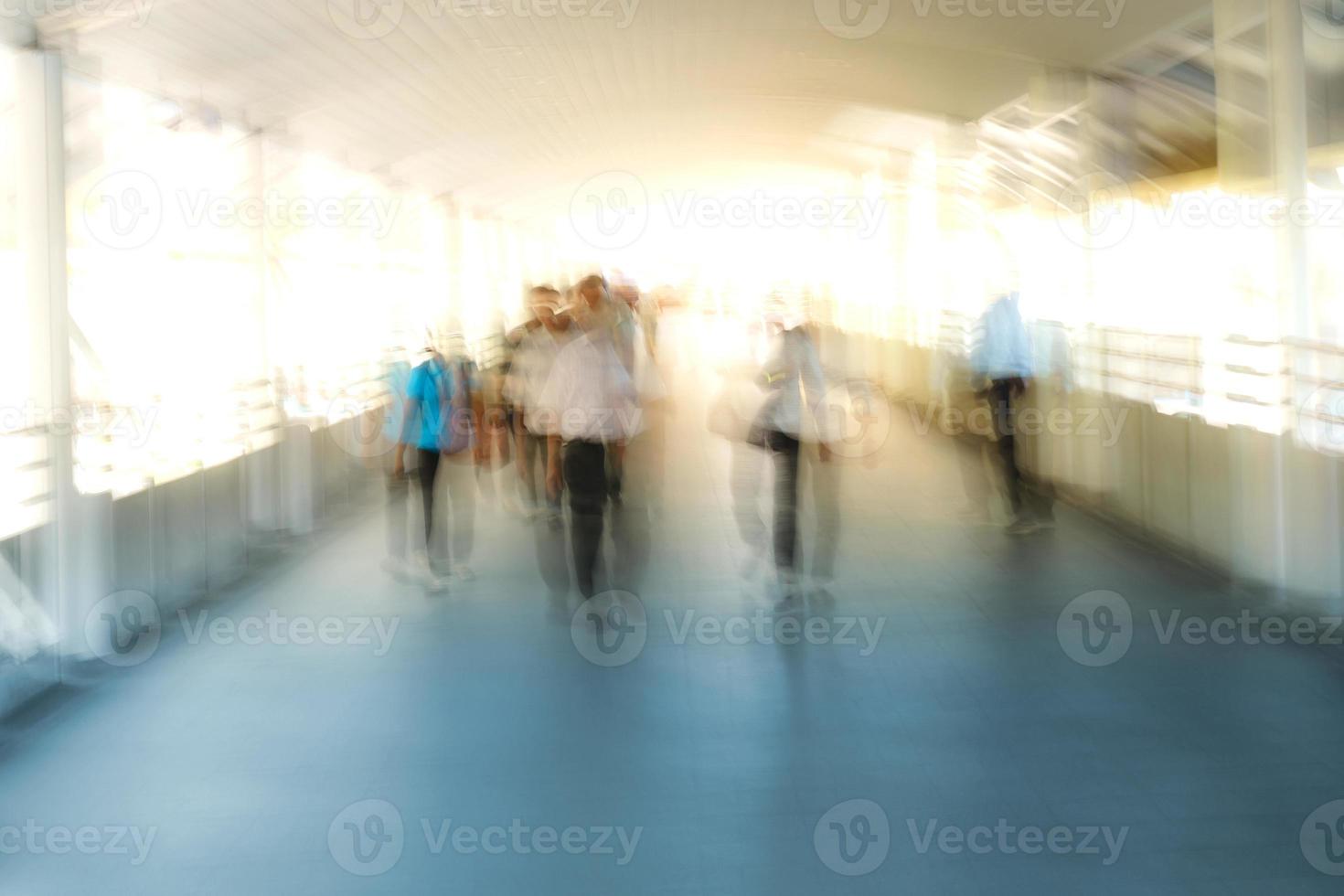 People walking in motion blur in the city photo