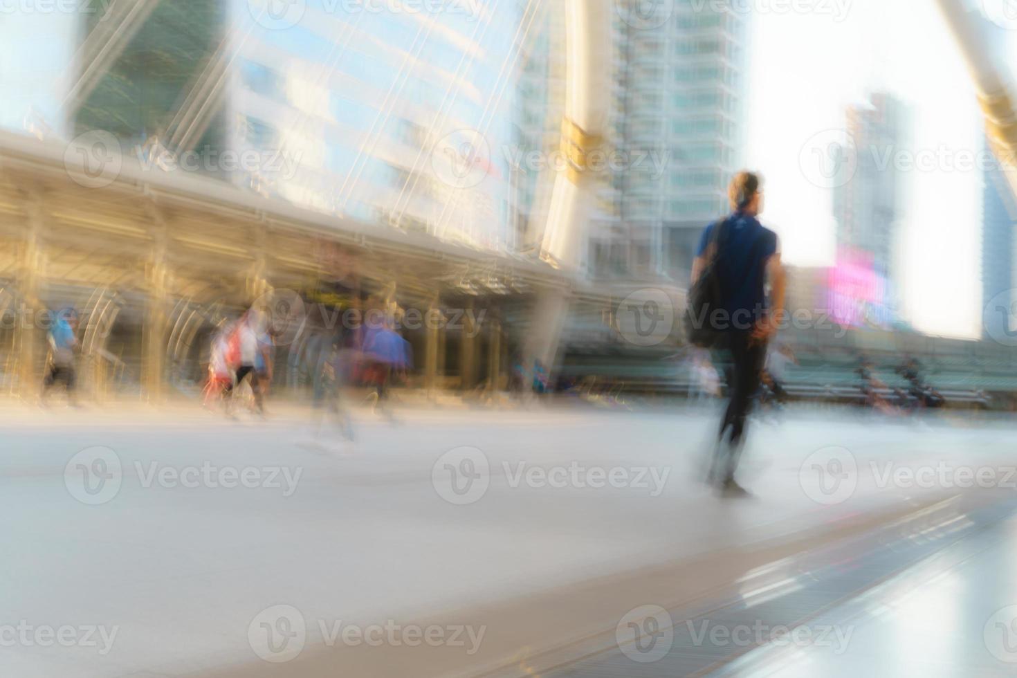 People walking in motion blur in the city photo