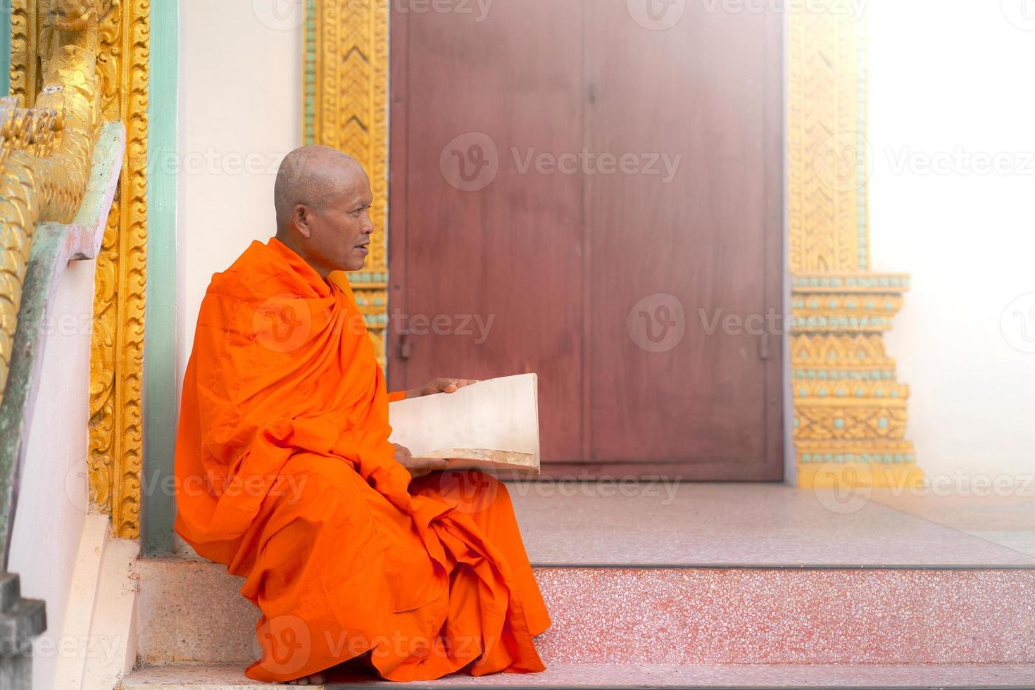 Monks in Thailand are reading books photo
