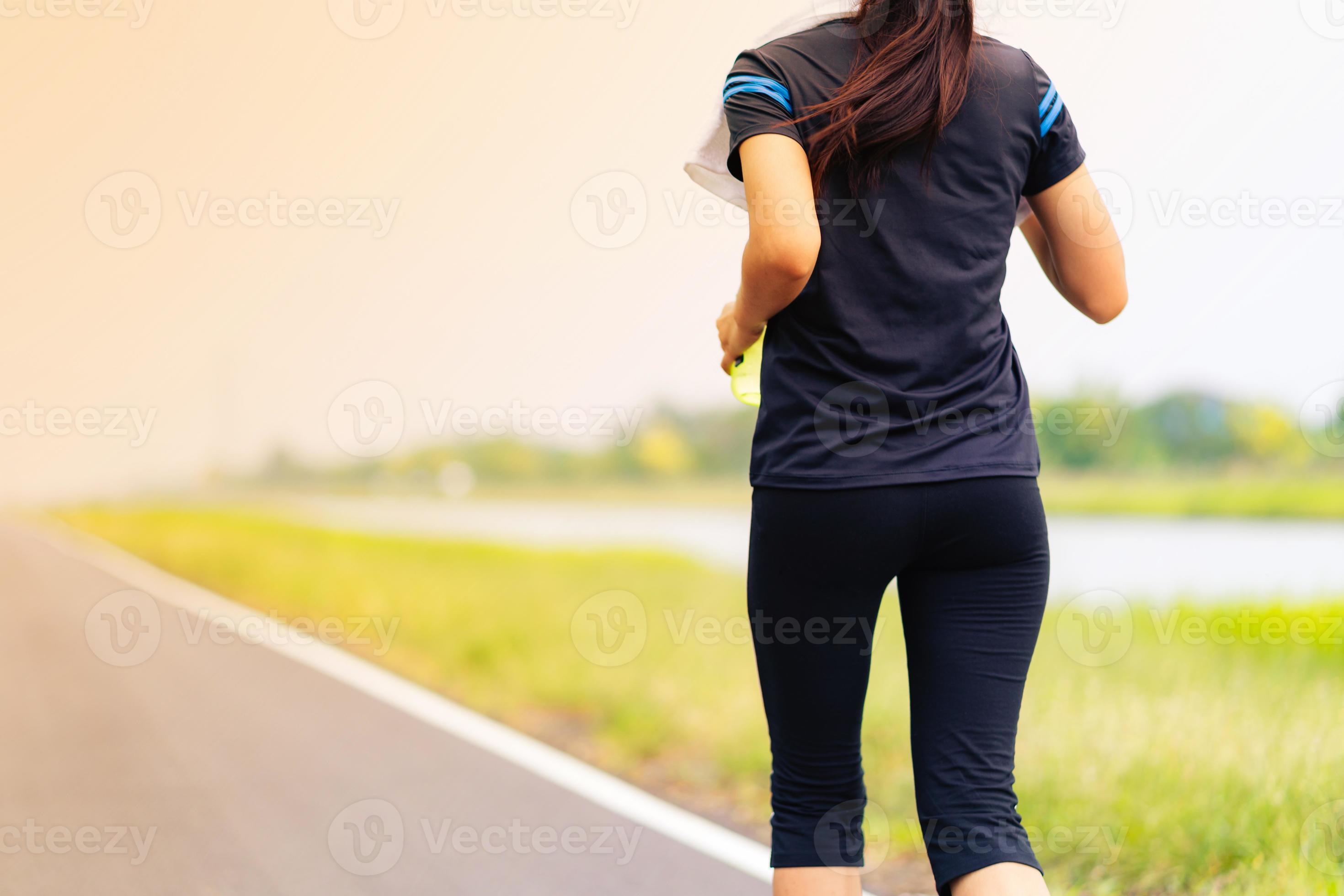 Beautiful girl running on road, Healthy fitness woman training 3001077  Stock Photo at Vecteezy