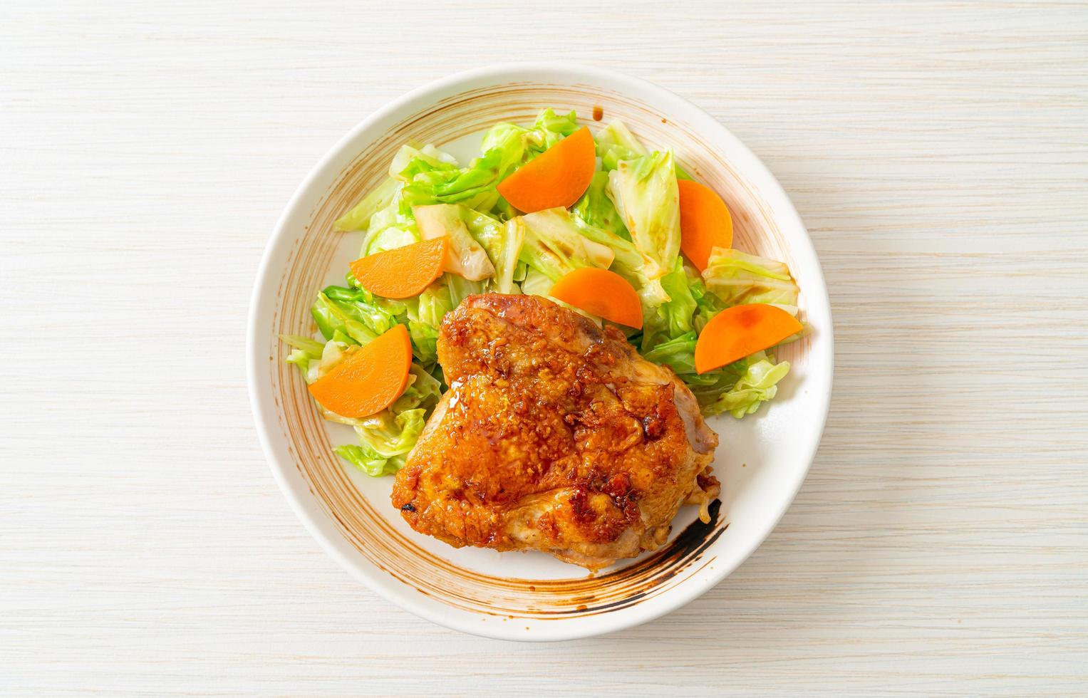 Teppanyaki teriyaki chicken steak with cabbage and carrot photo