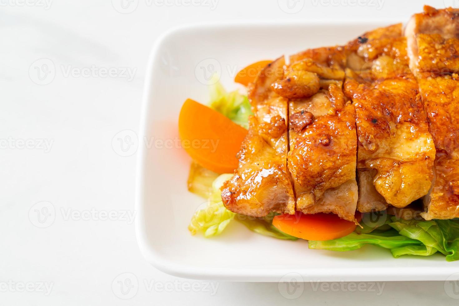 Teppanyaki teriyaki chicken steak with cabbage and carrot photo