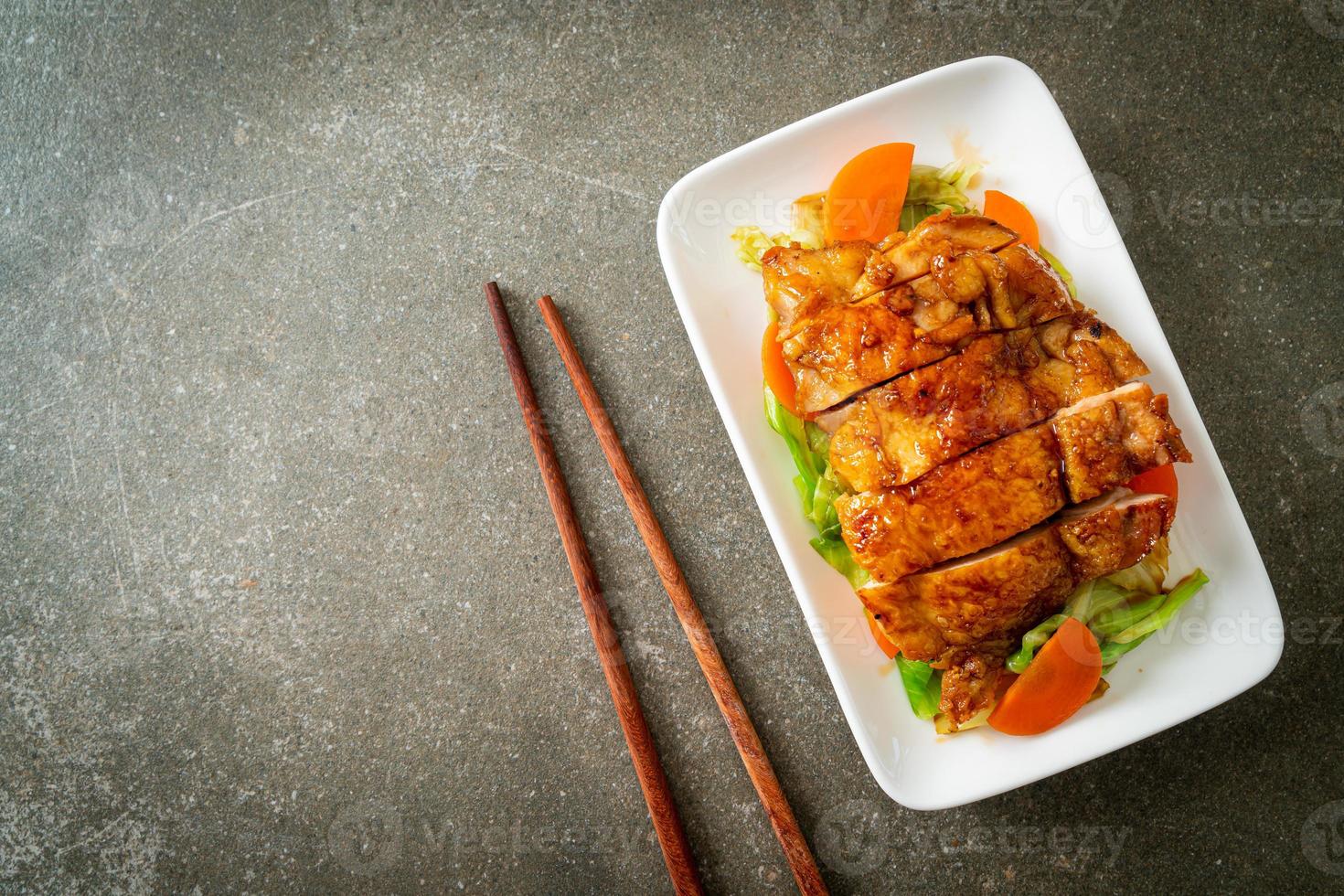 Teppanyaki teriyaki chicken steak with cabbage and carrot photo